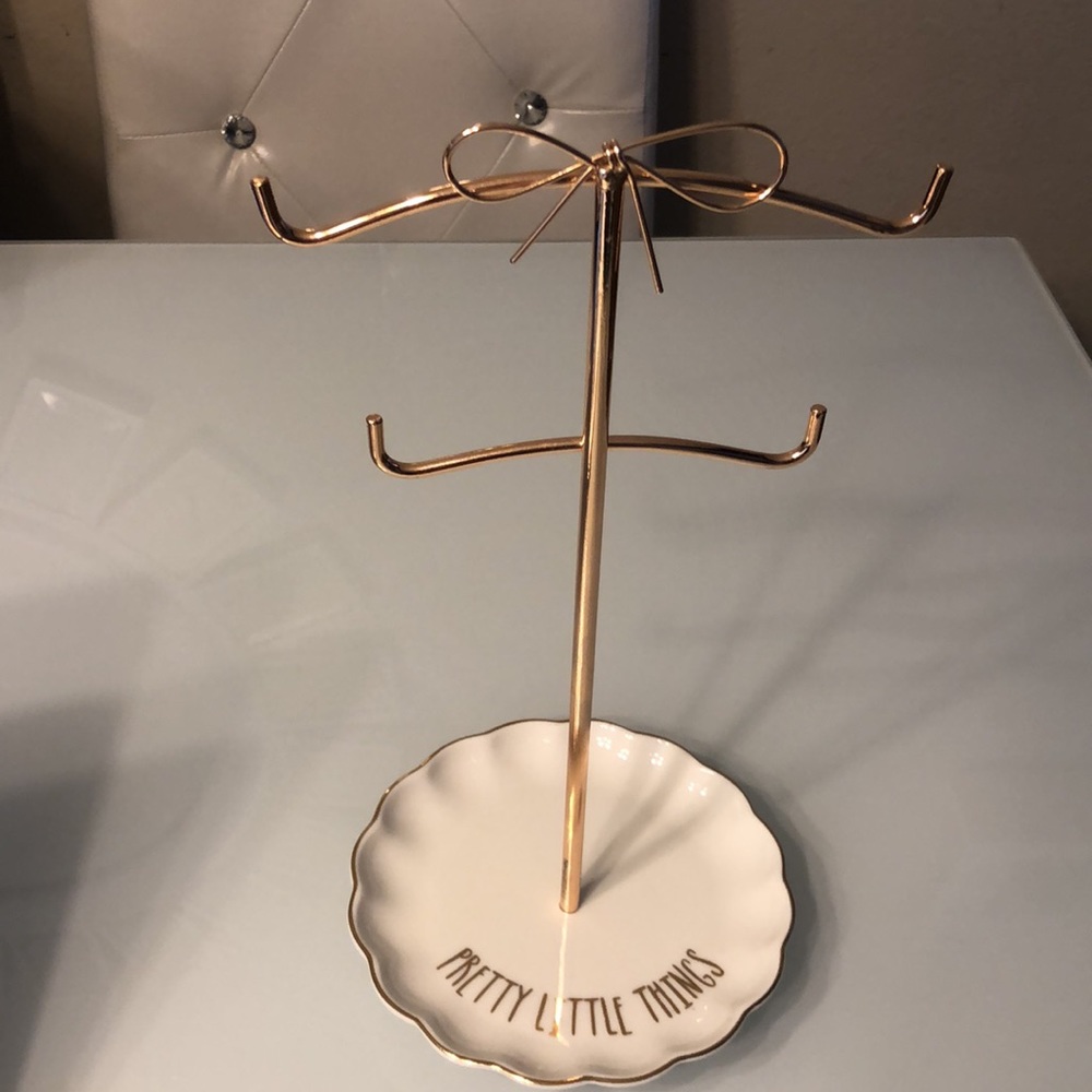 Clinton’s jewelry organizer stand  “pretty little things”